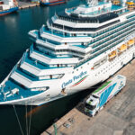 Camion elettrico LC3 Trasporti in operazioni di carico presso il porto di Genova: parte la sperimentazione per una logistica sostenibile al servizio delle forniture marittime.